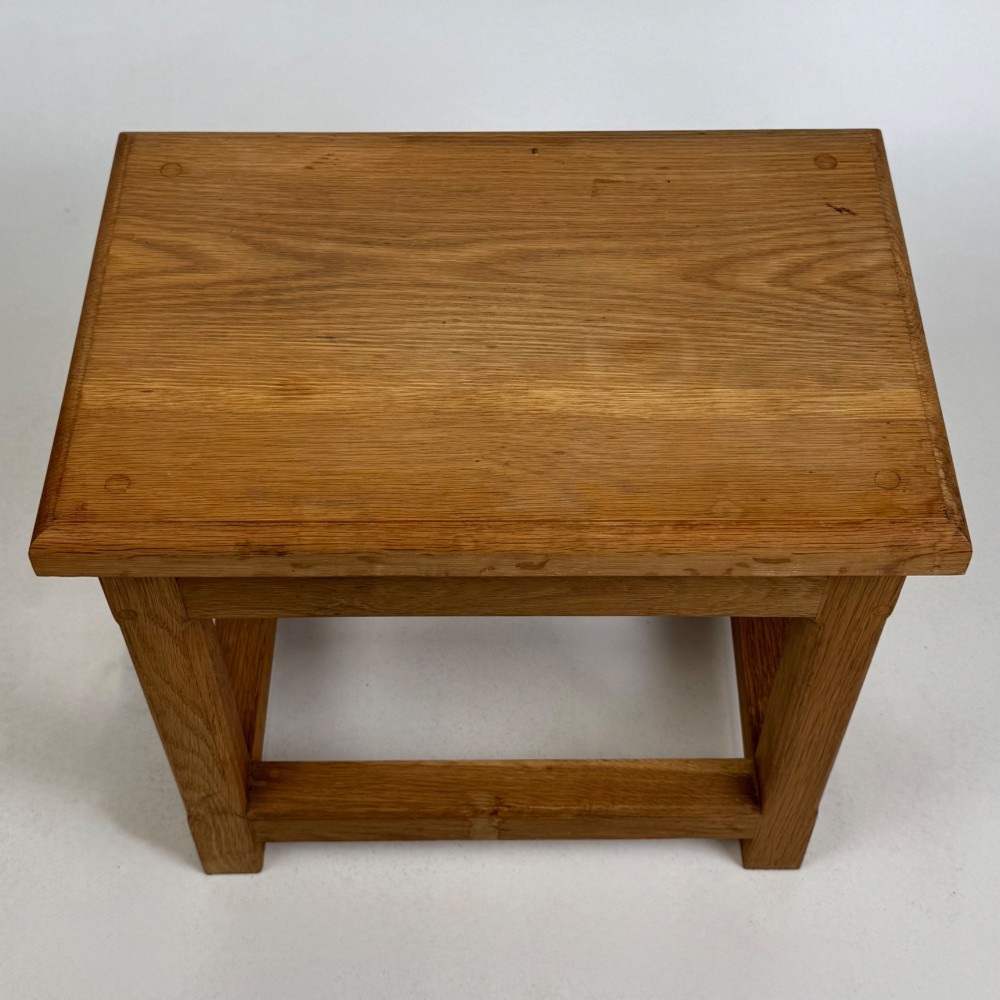 A solid oak rectangular joint stool featuring visible wooden dowel joinery and a sturdy base with lower stretchers. View IX