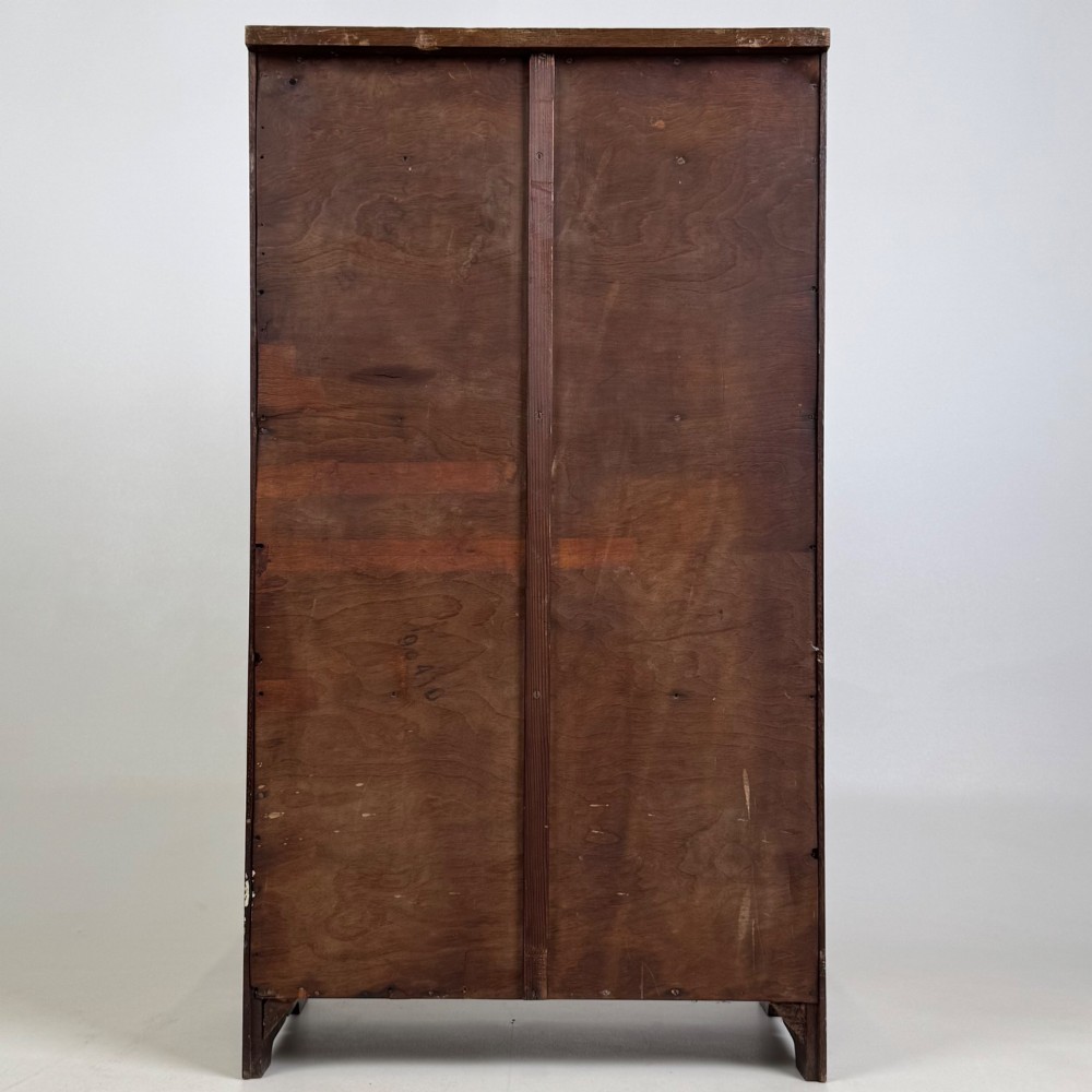 A small Edwardian open bookcase crafted from dark oak timber featuring three open shelves and a shaped apron base. View VI