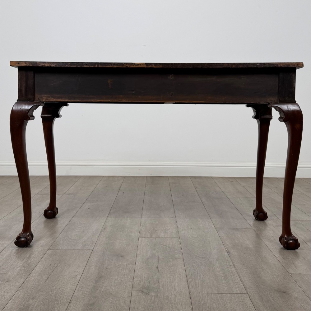 A 19th-century Chippendale style mahogany side table featuring carved cabriole legs ending in ball and claw feet. View V