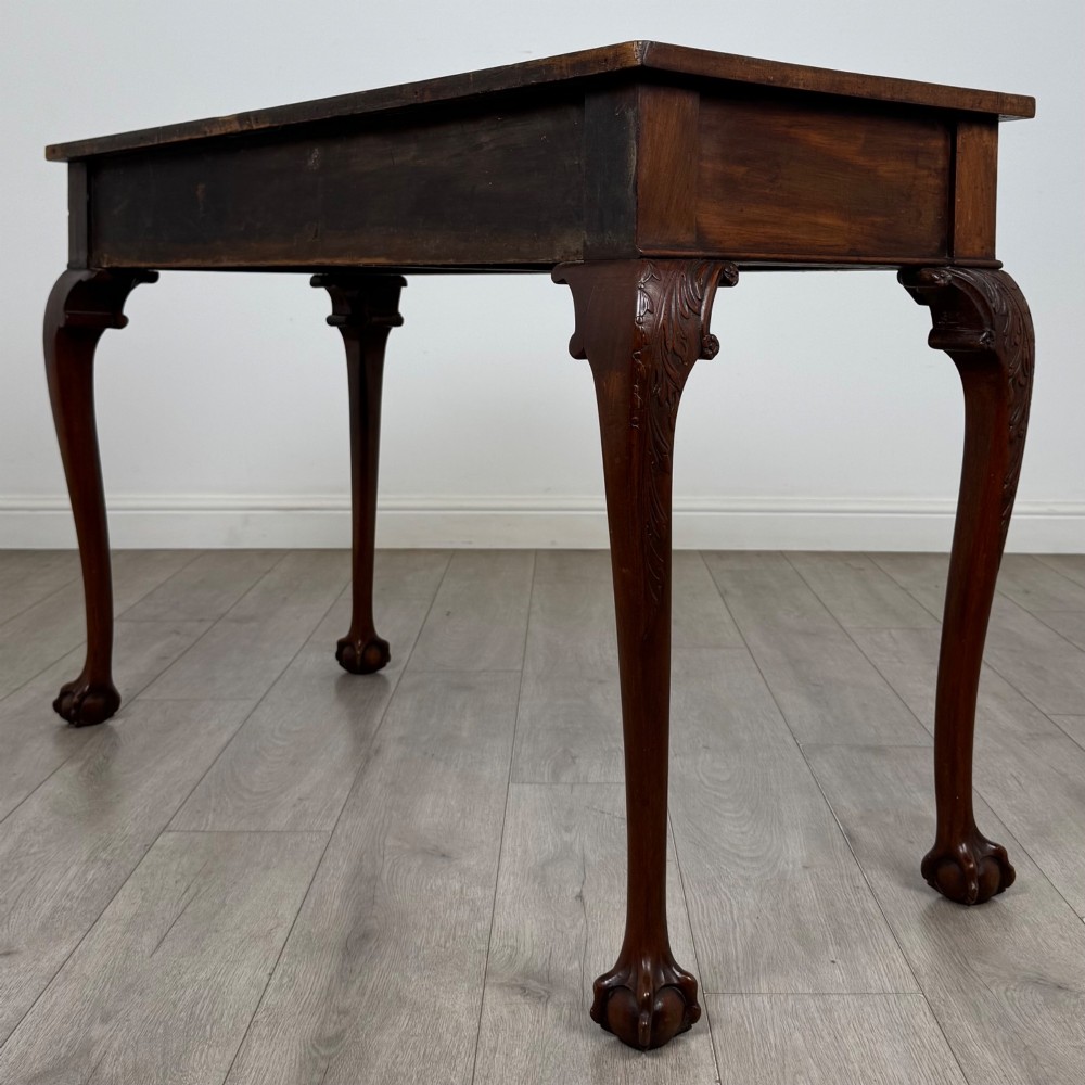 A 19th-century Chippendale style mahogany side table featuring carved cabriole legs ending in ball and claw feet. View VI