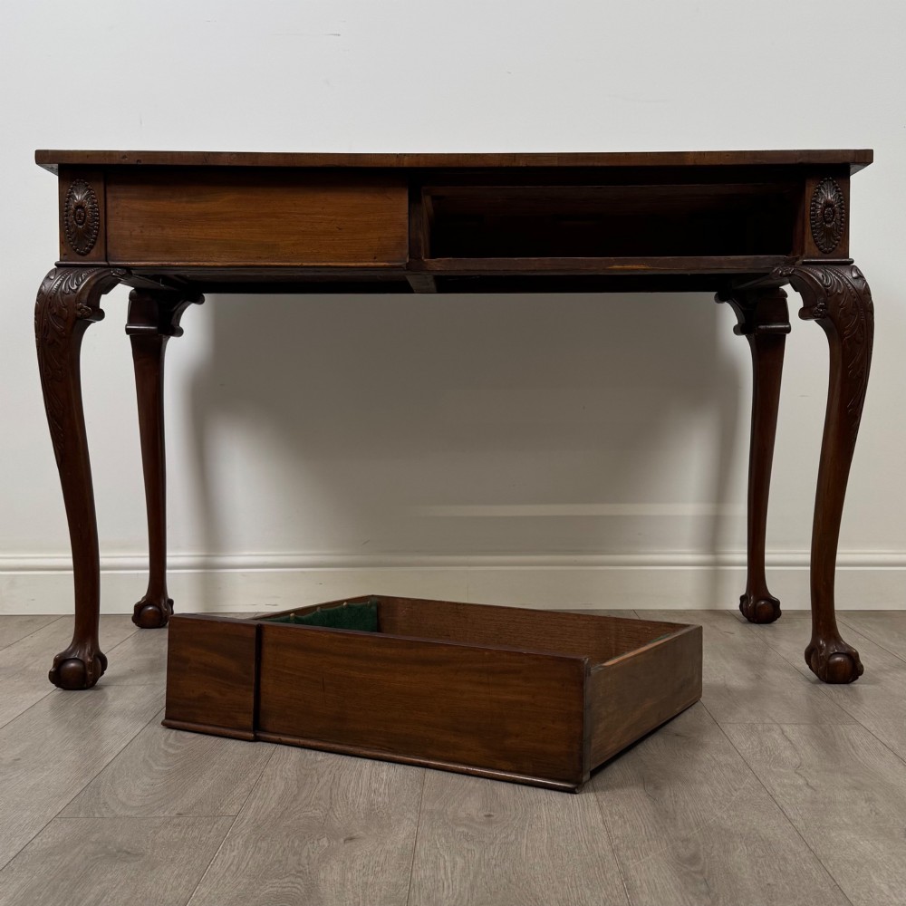 A 19th-century Chippendale style mahogany side table featuring carved cabriole legs ending in ball and claw feet. View X