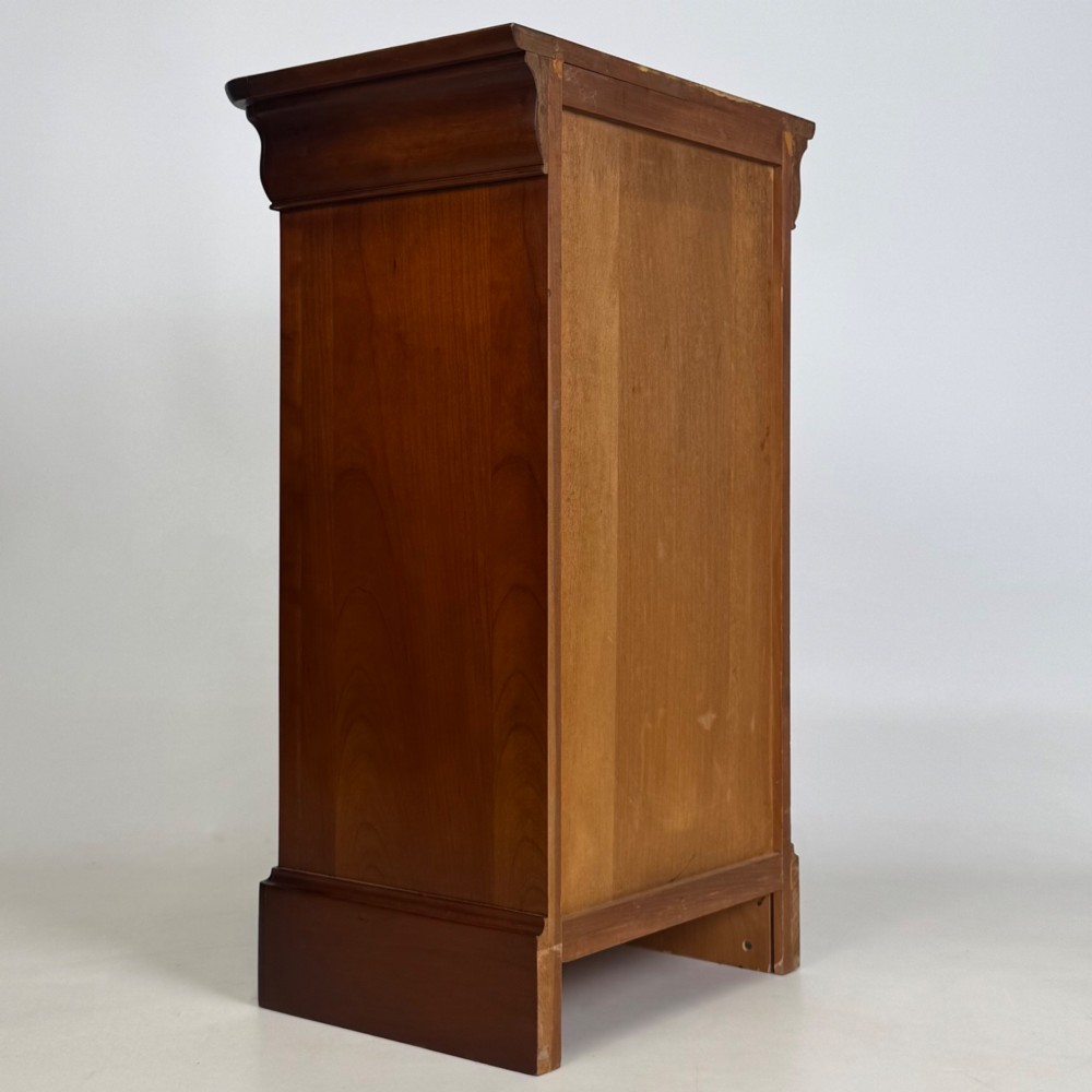 A matching pair of 20th-century mahogany bedside cabinets featuring single panelled doors, turned wooden handles, moulded cornices, and solid plinth bases. View VI