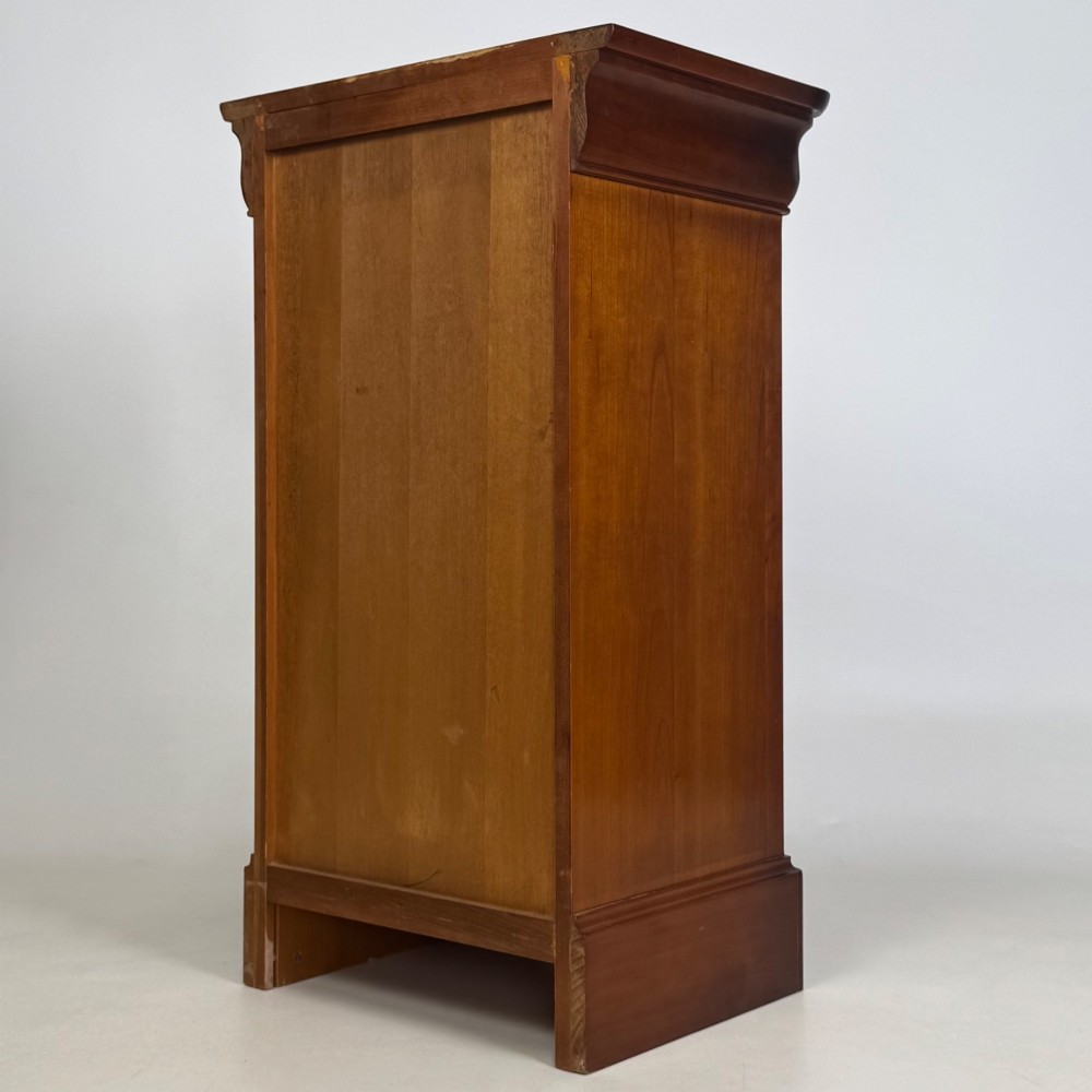 A matching pair of 20th-century mahogany bedside cabinets featuring single panelled doors, turned wooden handles, moulded cornices, and solid plinth bases. View VIII