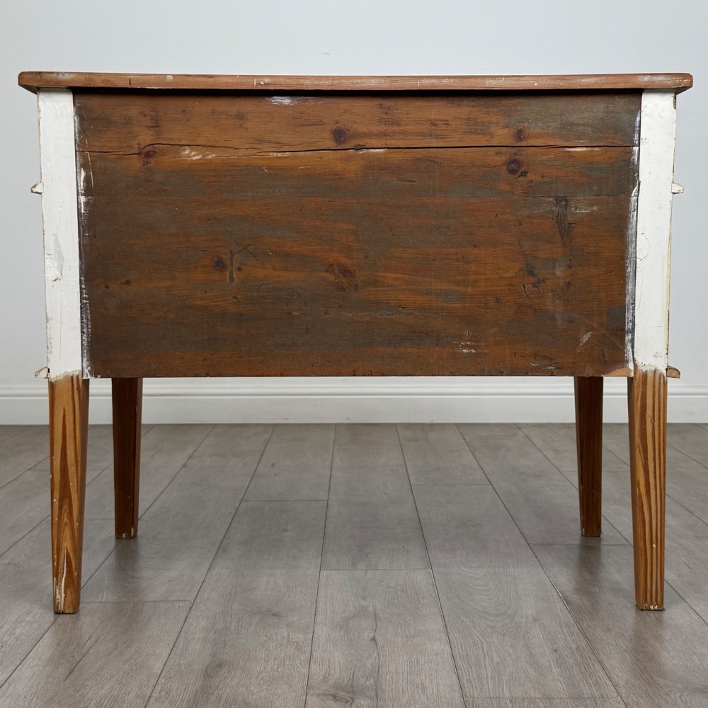 A Victorian pitch pine cupboard featuring a single top drawer over two cupboard doors with diagonal timber panels and straight tapered legs. View VI