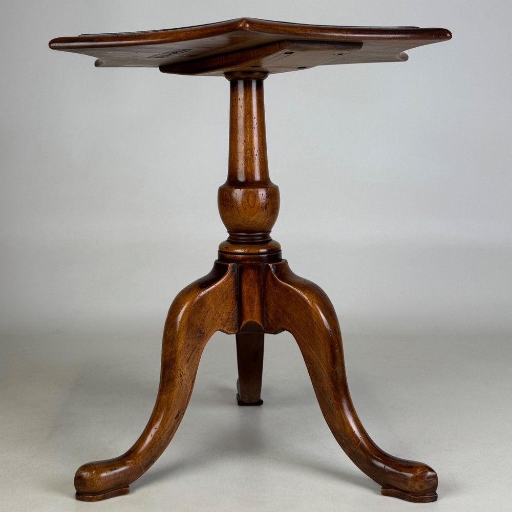 A walnut tripod side table featuring a baluster-turned central pedestal, three splayed cabriole legs, and a shaped top. View III