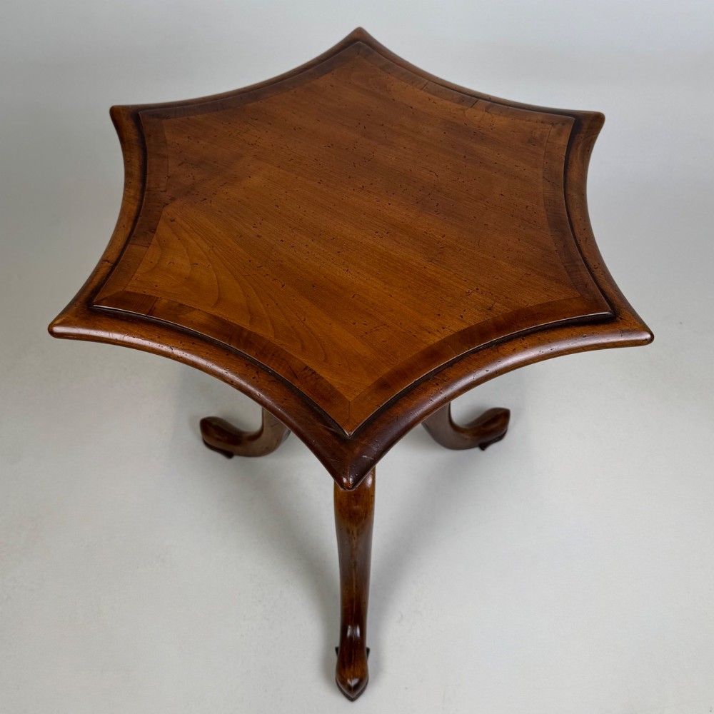 A walnut tripod side table featuring a baluster-turned central pedestal, three splayed cabriole legs, and a shaped top. View V