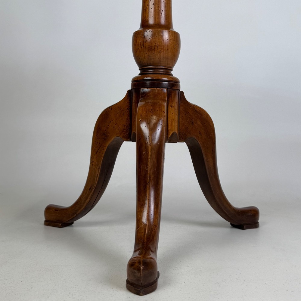 A walnut tripod side table featuring a baluster-turned central pedestal, three splayed cabriole legs, and a shaped top. View VI