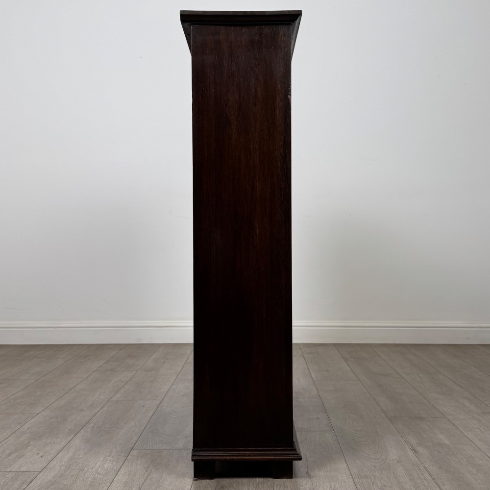 An Edwardian open oak bookcase with four wide shelves and dark timber finish. View VIII