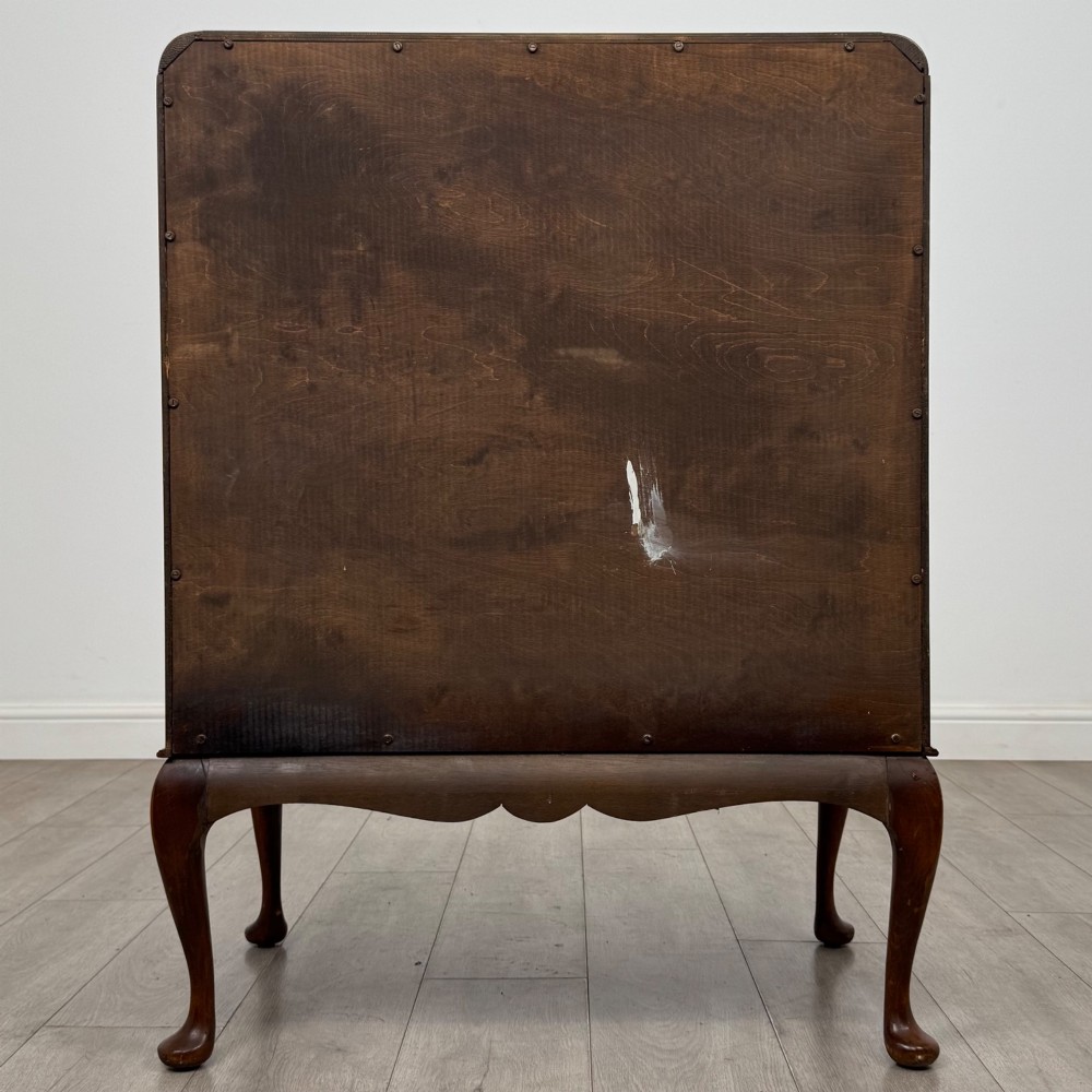 An Edwardian figured walnut writing bureau featuring a slant front above three drawers and carved cabriole legs. View VI