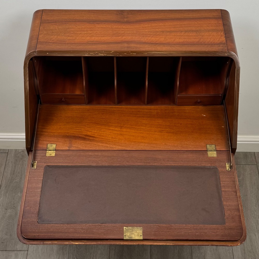 An Edwardian figured walnut writing bureau featuring a slant front above three drawers and carved cabriole legs. View XI