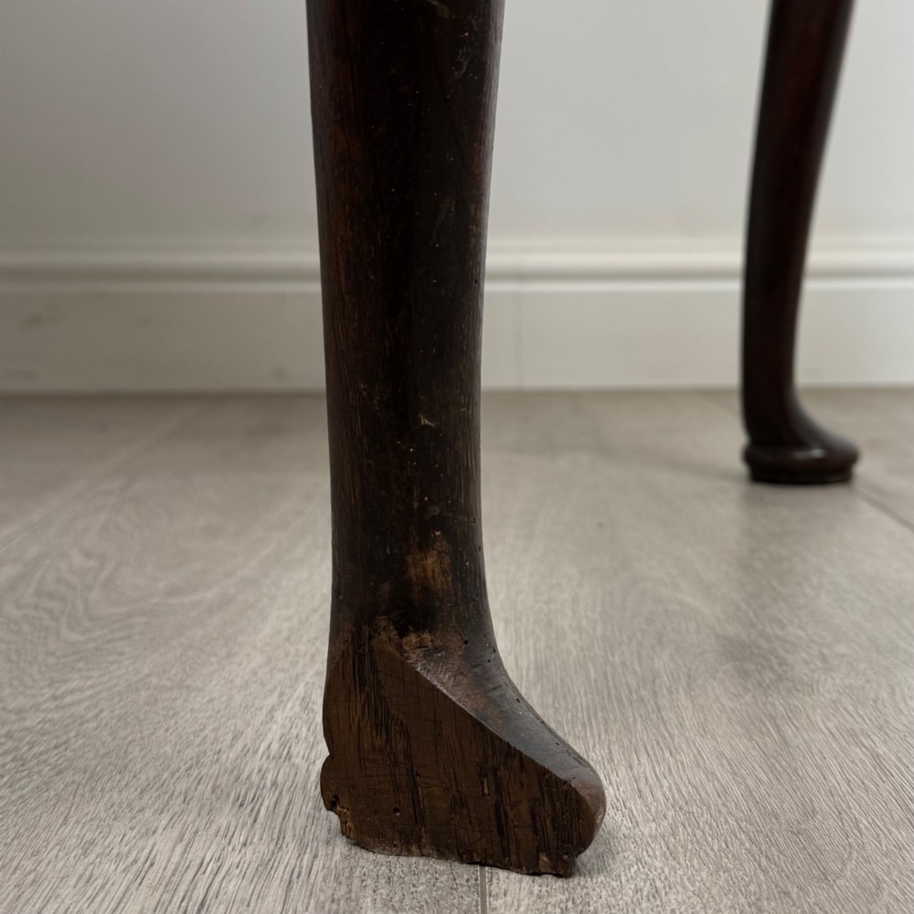 An 18th-century Georgian oak side table featuring three drawers with brass drop handles, an arched apron, and cabriole legs. View XII