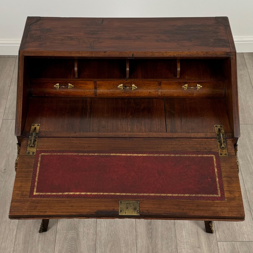 A 19th-century French rosewood bureau de dame with floral marquetry inlay on the hinged top and apron, raised on cabriole legs with gilt-bronze ormolu mounts. View XI