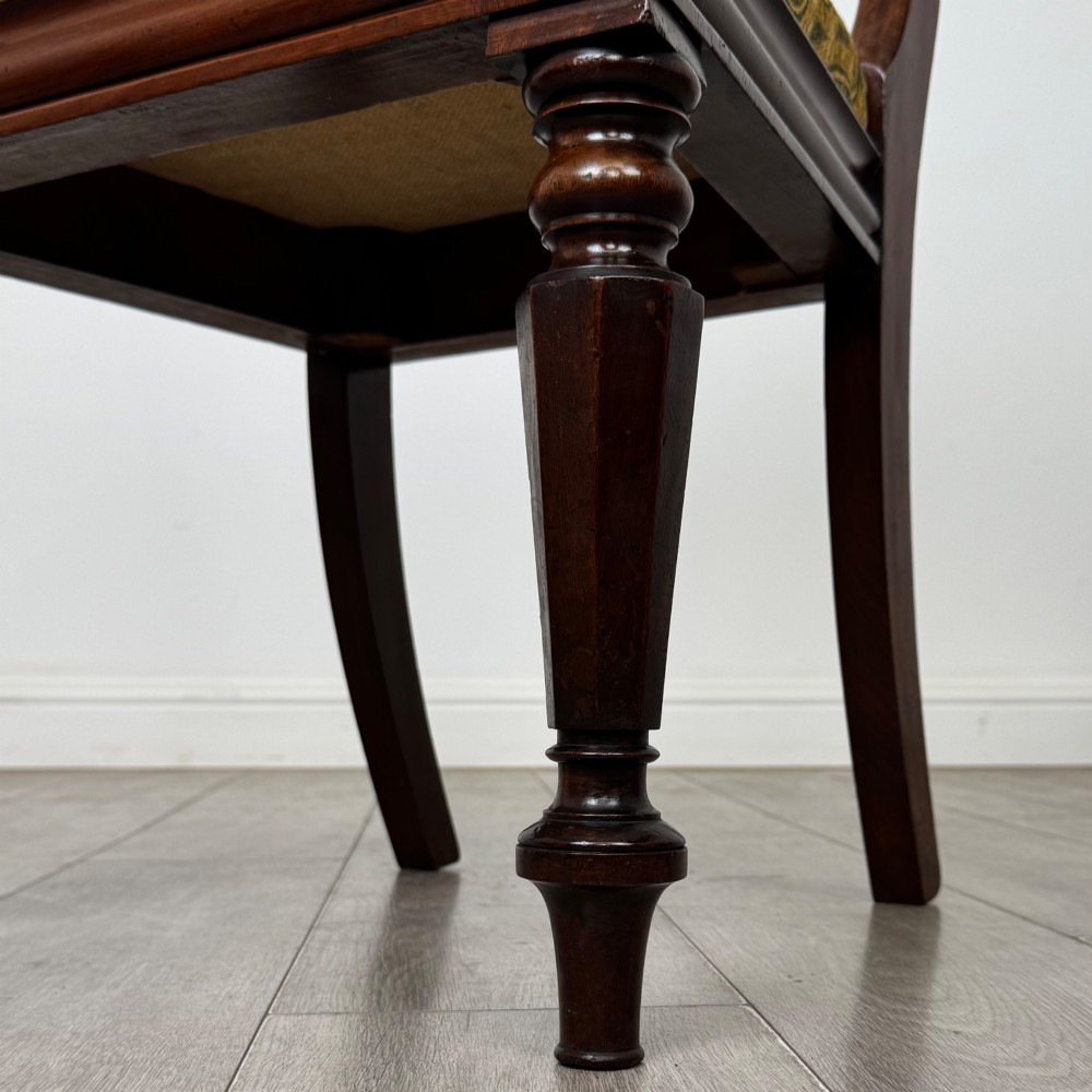 A set of six 19th-century William IV mahogany dining chairs featuring turned front legs, curved back rails, and green patterned fabric seats. View VI