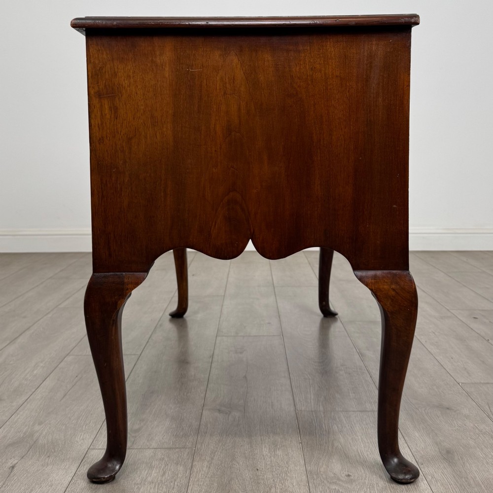 A 19th-century Victorian writing table crafted from burr walnut with five drawer fronts, ornate brass drop handles, a shaped central kneehole, and cabriole legs. View III
