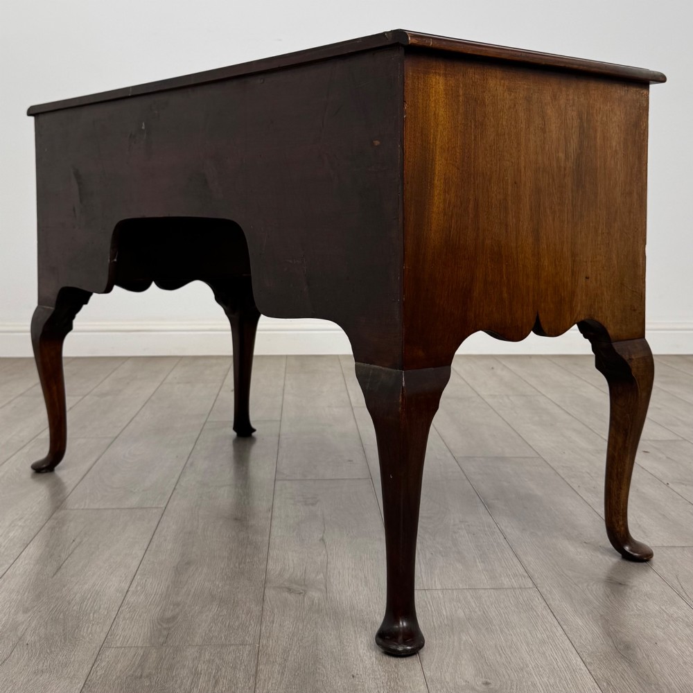 A 19th-century Victorian writing table crafted from burr walnut with five drawer fronts, ornate brass drop handles, a shaped central kneehole, and cabriole legs. View VI