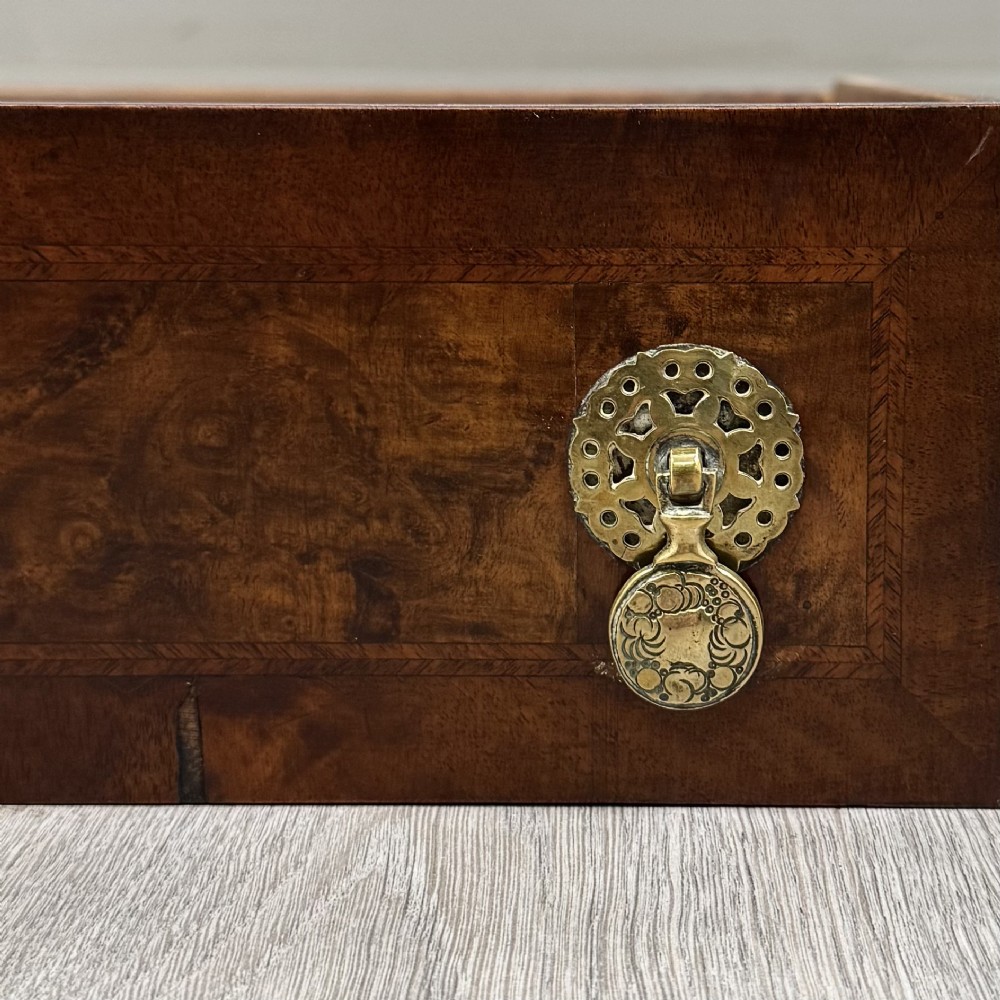 A 19th-century Victorian writing table crafted from burr walnut with five drawer fronts, ornate brass drop handles, a shaped central kneehole, and cabriole legs. View XI