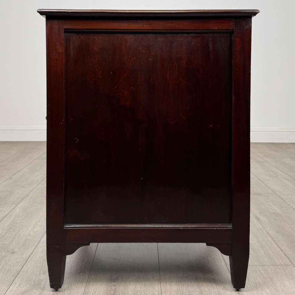 A dark stained oak Edwardian cupboard featuring a single panel door, teardrop handle, and square tapered legs. View IV