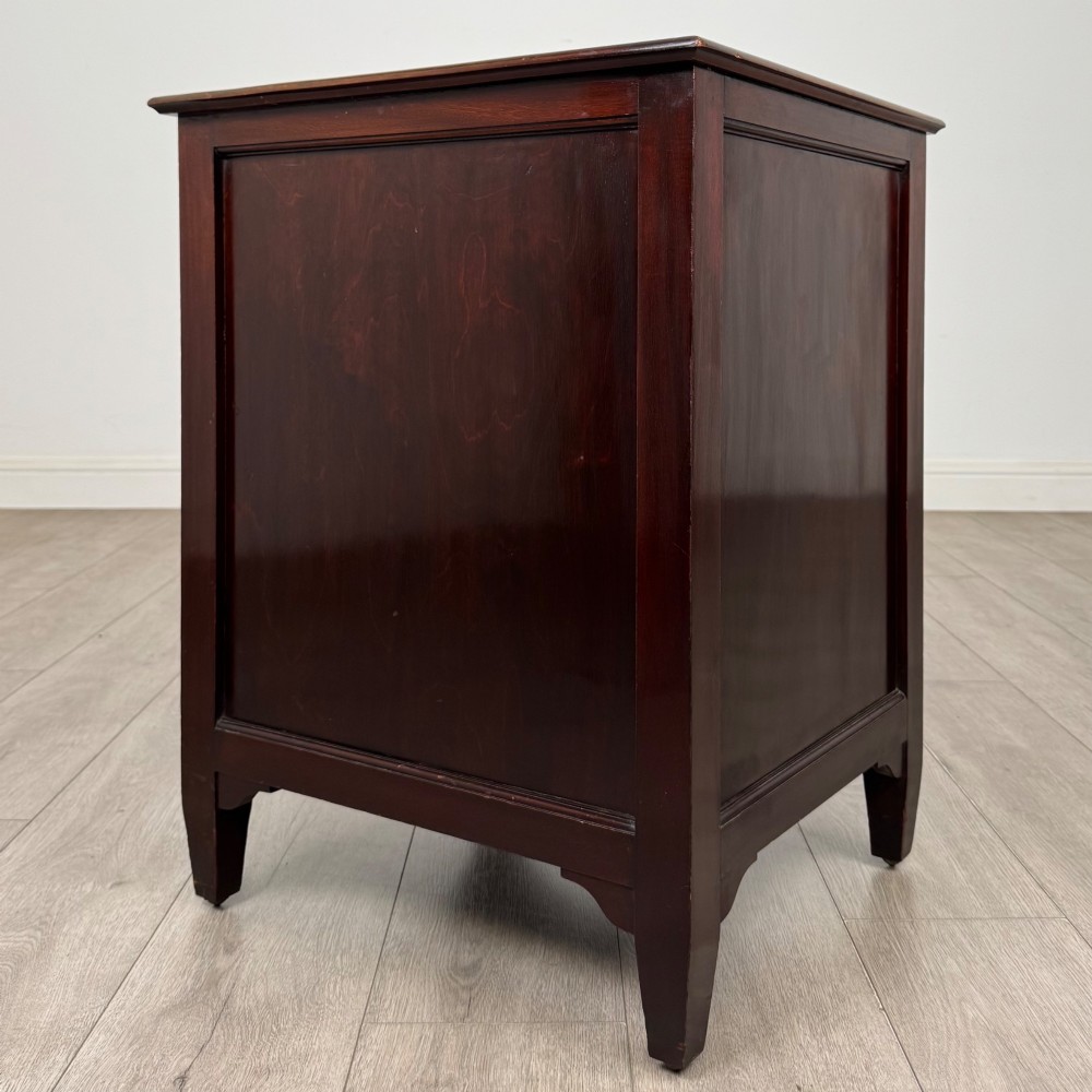 A dark stained oak Edwardian cupboard featuring a single panel door, teardrop handle, and square tapered legs. View V