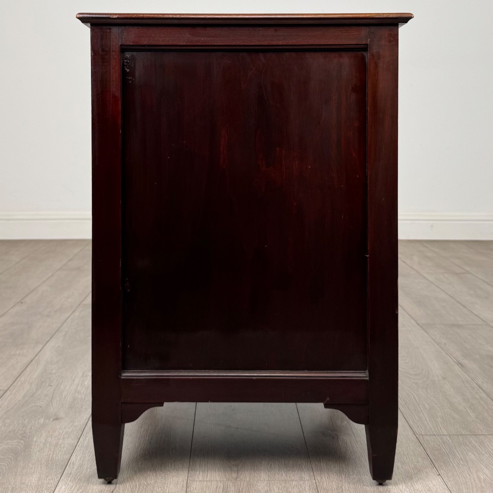 A dark stained oak Edwardian cupboard featuring a single panel door, teardrop handle, and square tapered legs. View VI