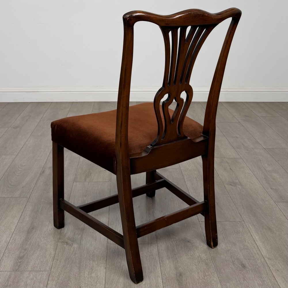 A set of six dark wood Georgian style dining chairs featuring pierced splat backs and dark brown velvet upholstered seats. View III