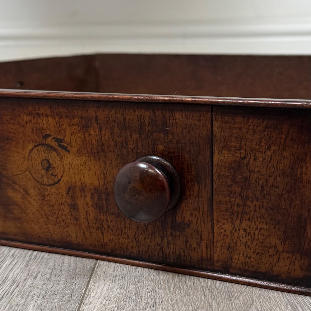 A dark mahogany Georgian style writing table featuring two frieze drawers with turned wood knobs and straight legs. View XI