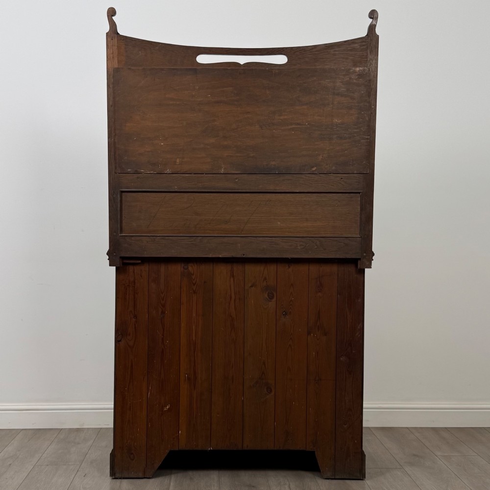 An early 20th-century warm brown oak mirror back sideboard featuring two drawers, a double-door cupboard base, and an elevated mirror plate cresting. View VI