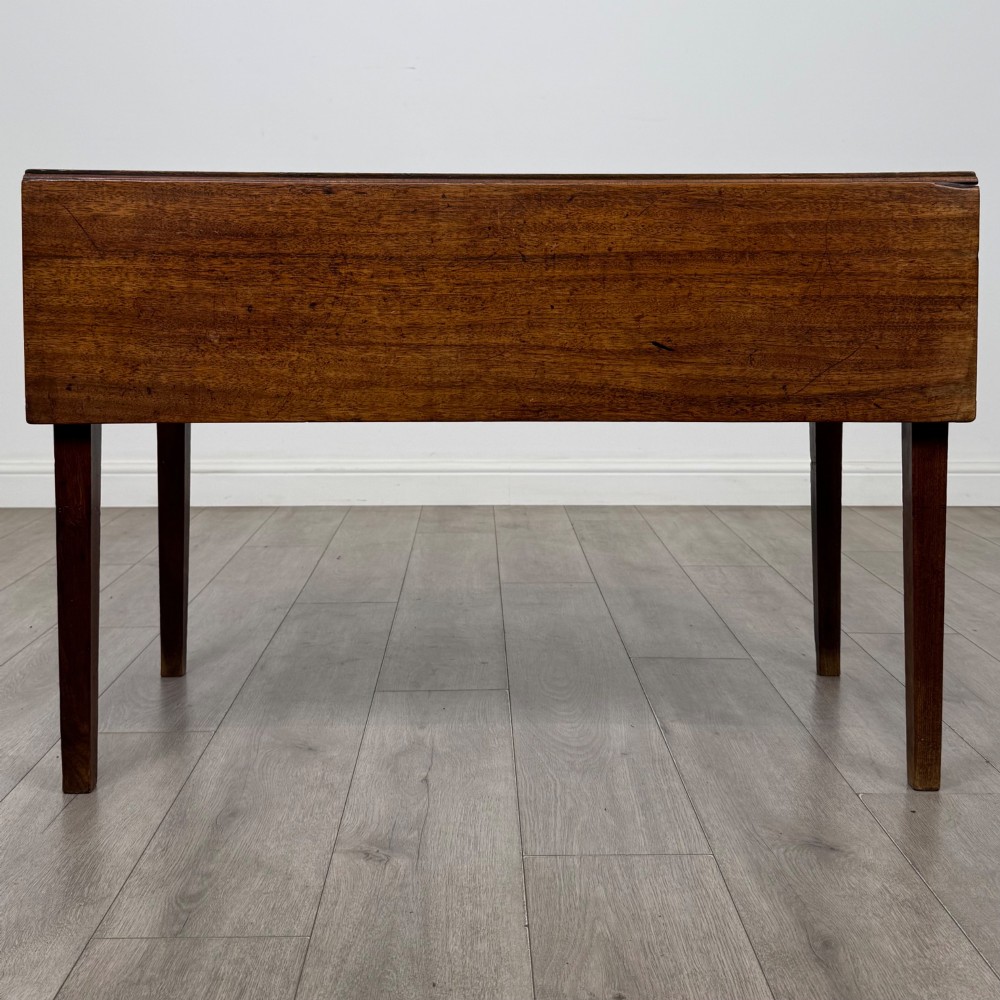 A 19th-century Georgian style dark mahogany Pembroke side table with drop leaves, tapered square legs, and a single frieze drawer with a brass drop handle. View II