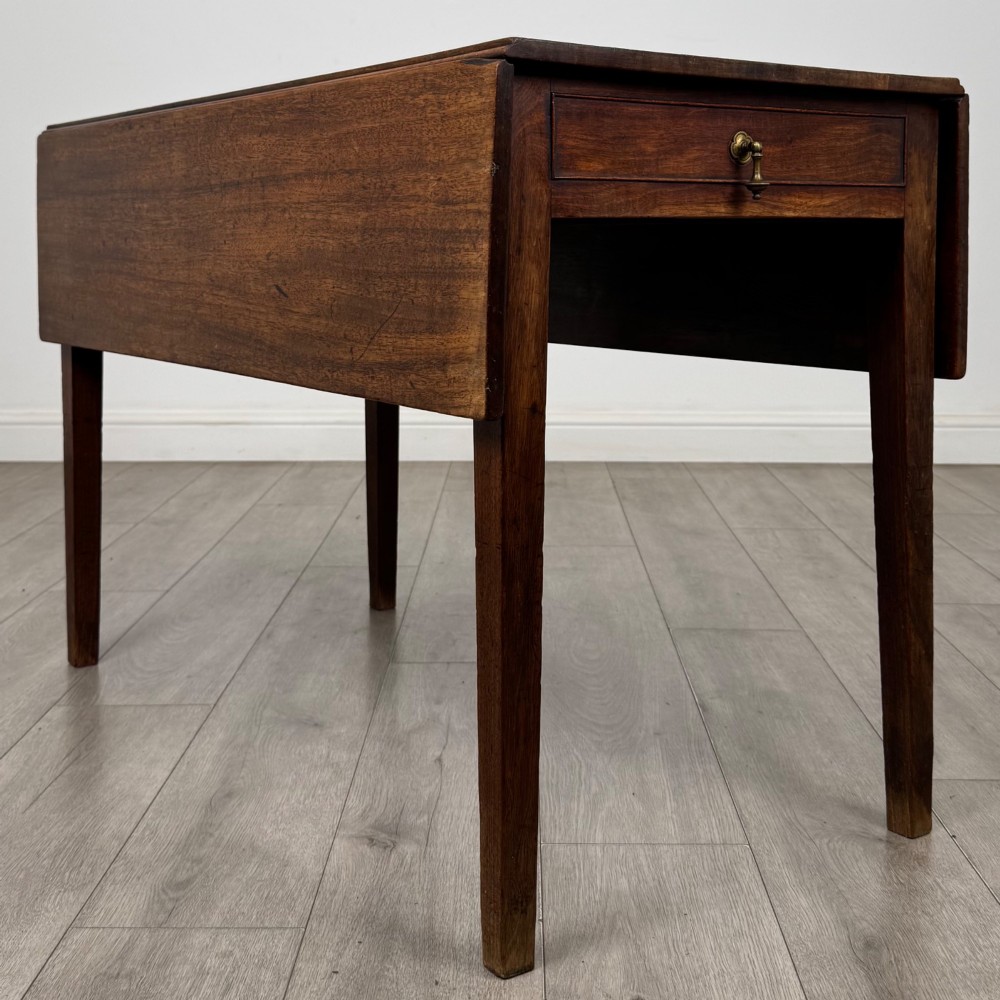 A 19th-century Georgian style dark mahogany Pembroke side table with drop leaves, tapered square legs, and a single frieze drawer with a brass drop handle. View III