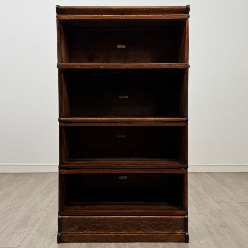 An early twentieth-century oak four-tier Globe Wernicke stacking bookcase featuring glazed lift-and-slide doors. View II