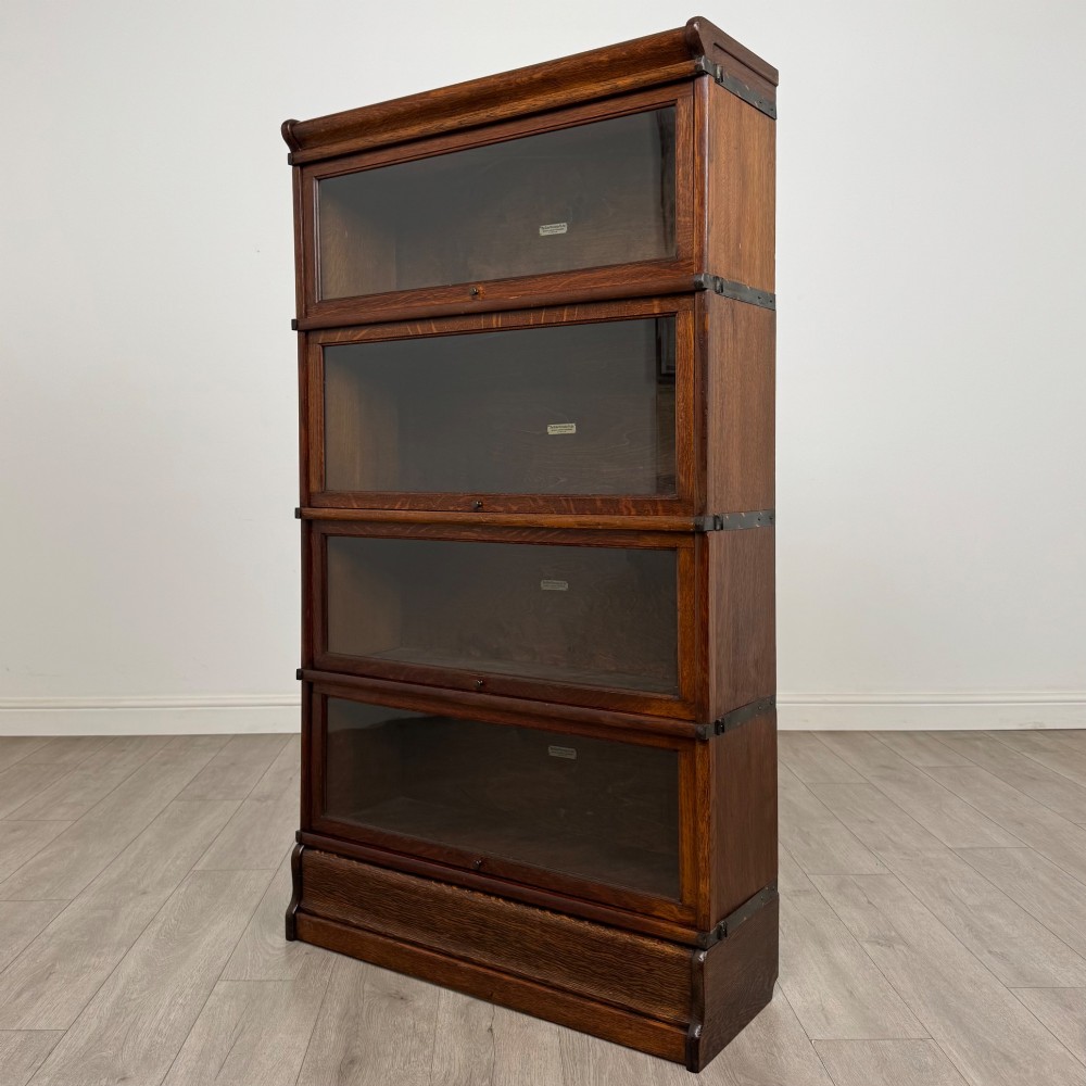 An early twentieth-century oak four-tier Globe Wernicke stacking bookcase featuring glazed lift-and-slide doors. View III