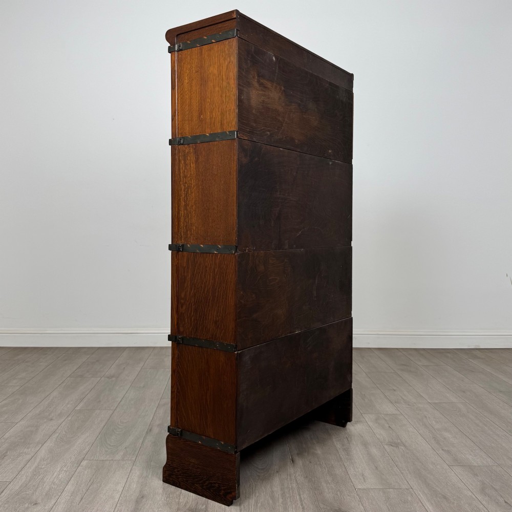 An early twentieth-century oak four-tier Globe Wernicke stacking bookcase featuring glazed lift-and-slide doors. View V