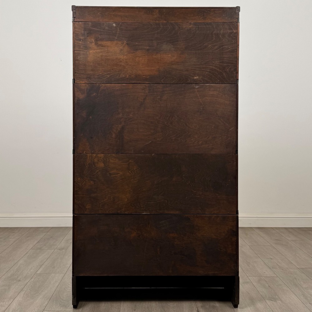An early twentieth-century oak four-tier Globe Wernicke stacking bookcase featuring glazed lift-and-slide doors. View VI