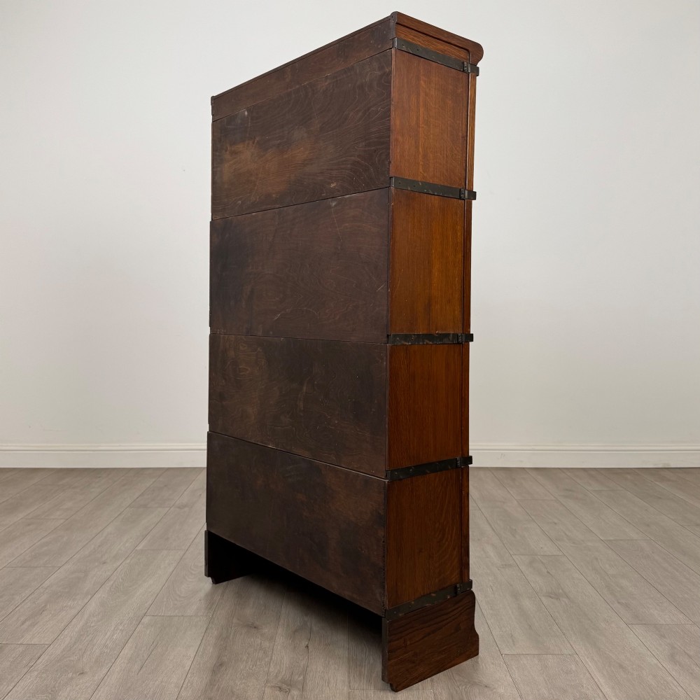An early twentieth-century oak four-tier Globe Wernicke stacking bookcase featuring glazed lift-and-slide doors. View VII