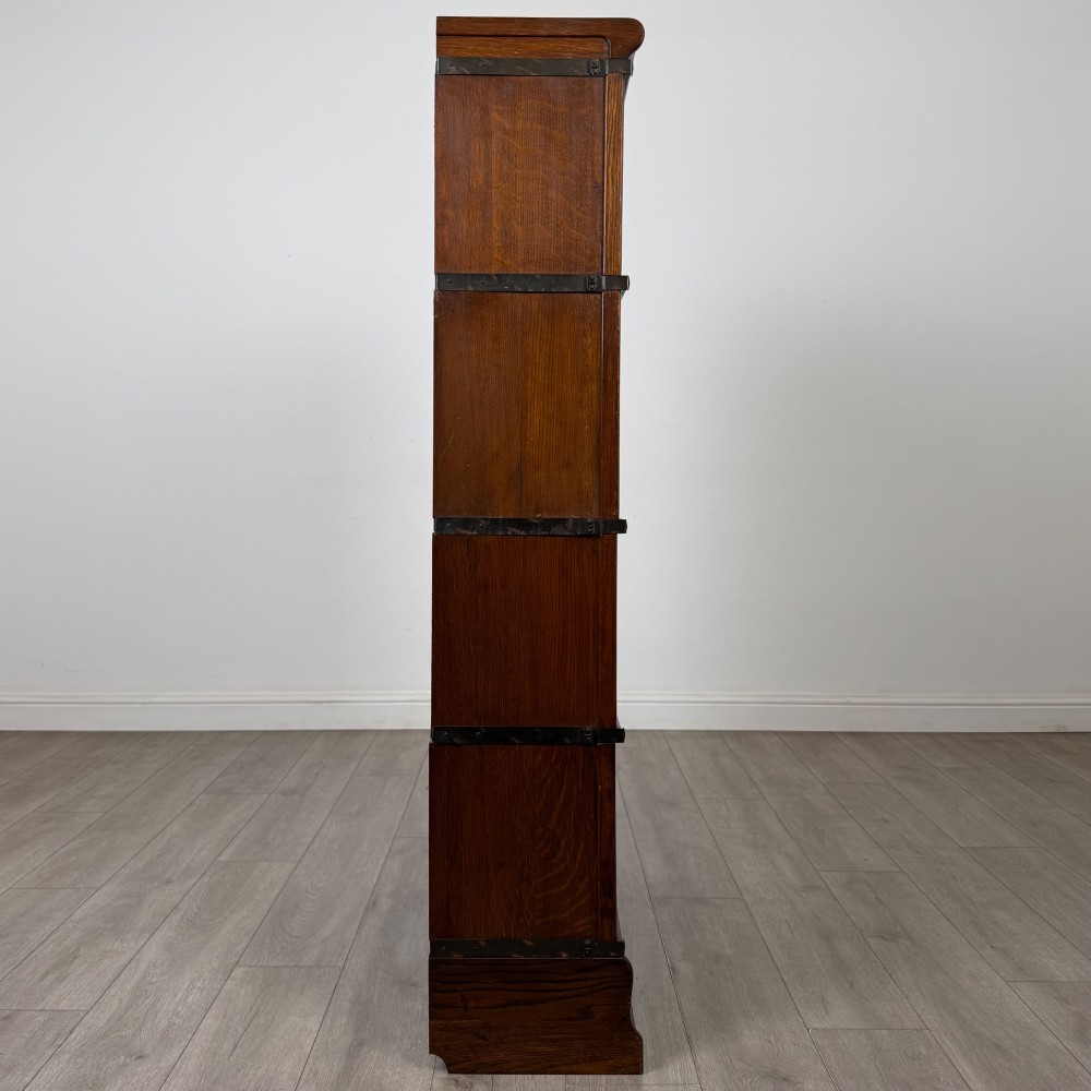 An early twentieth-century oak four-tier Globe Wernicke stacking bookcase featuring glazed lift-and-slide doors. View VIII