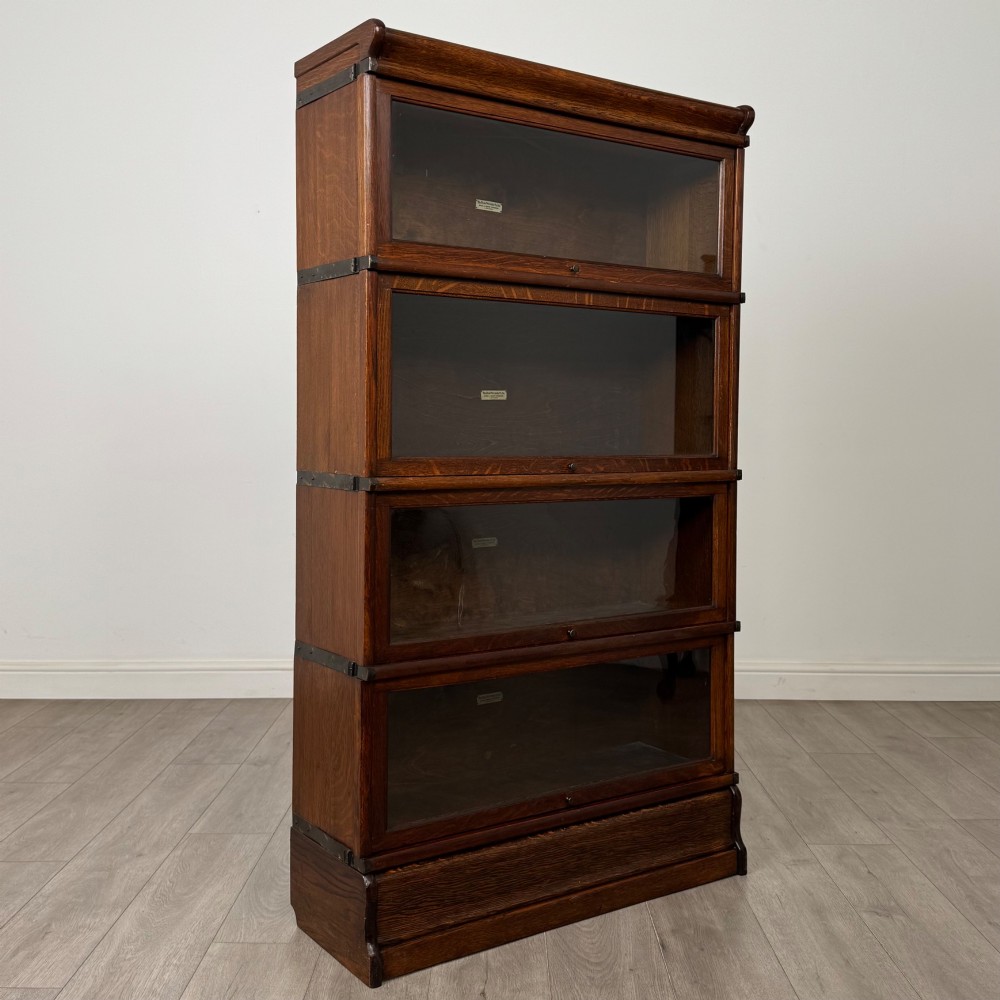 An early twentieth-century oak four-tier Globe Wernicke stacking bookcase featuring glazed lift-and-slide doors. View IX