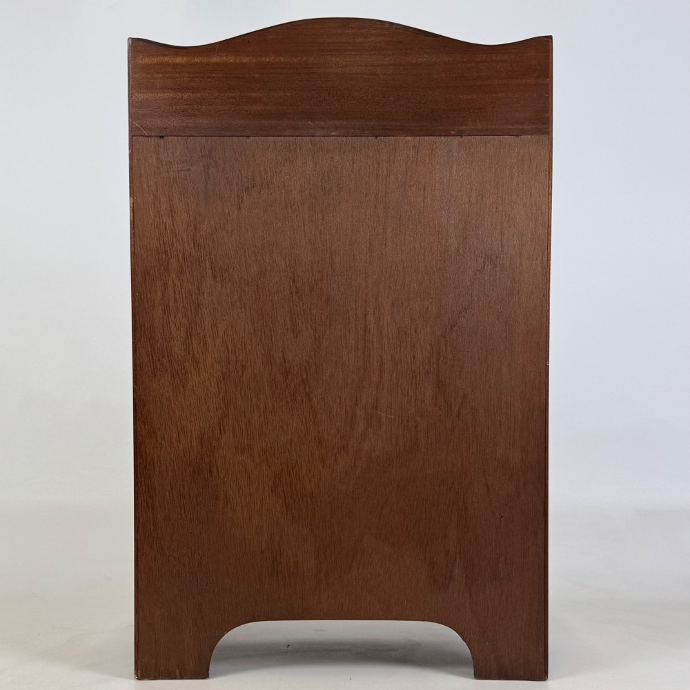A small 20th-century mahogany open bookcase with a shaped top gallery, two open shelves, and a single lower drawer fitted with brass ring handles. View VI