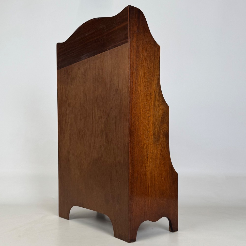 A small 20th-century mahogany open bookcase with a shaped top gallery, two open shelves, and a single lower drawer fitted with brass ring handles. View VII
