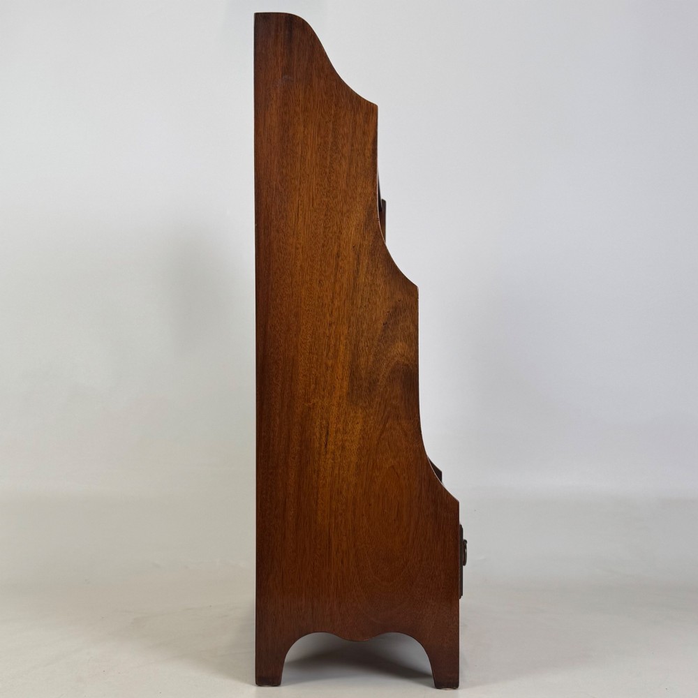 A small 20th-century mahogany open bookcase with a shaped top gallery, two open shelves, and a single lower drawer fitted with brass ring handles. View VIII