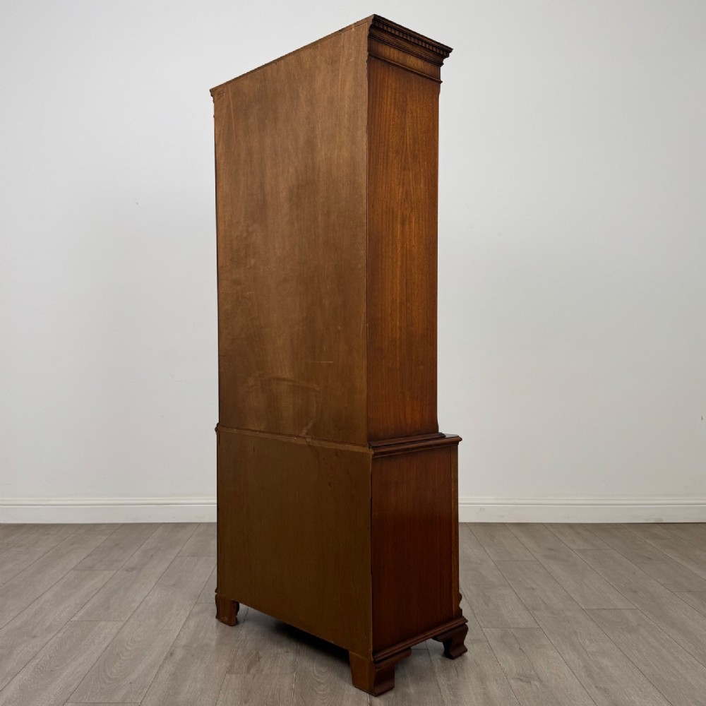 A tall Georgian style mahogany bookcase featuring two glazed doors with gothic arch tracery above a lower section with three drawers. View VIII