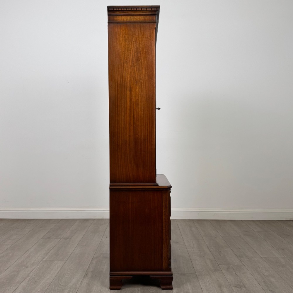 A tall Georgian style mahogany bookcase featuring two glazed doors with gothic arch tracery above a lower section with three drawers. View IX