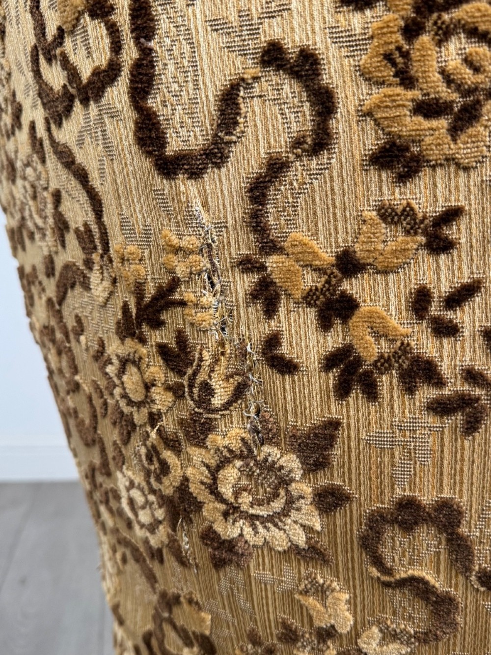 A 19th-century Victorian open armchair constructed from carved walnut wood and upholstered in a patterned gold and brown velvet fabric. View XII