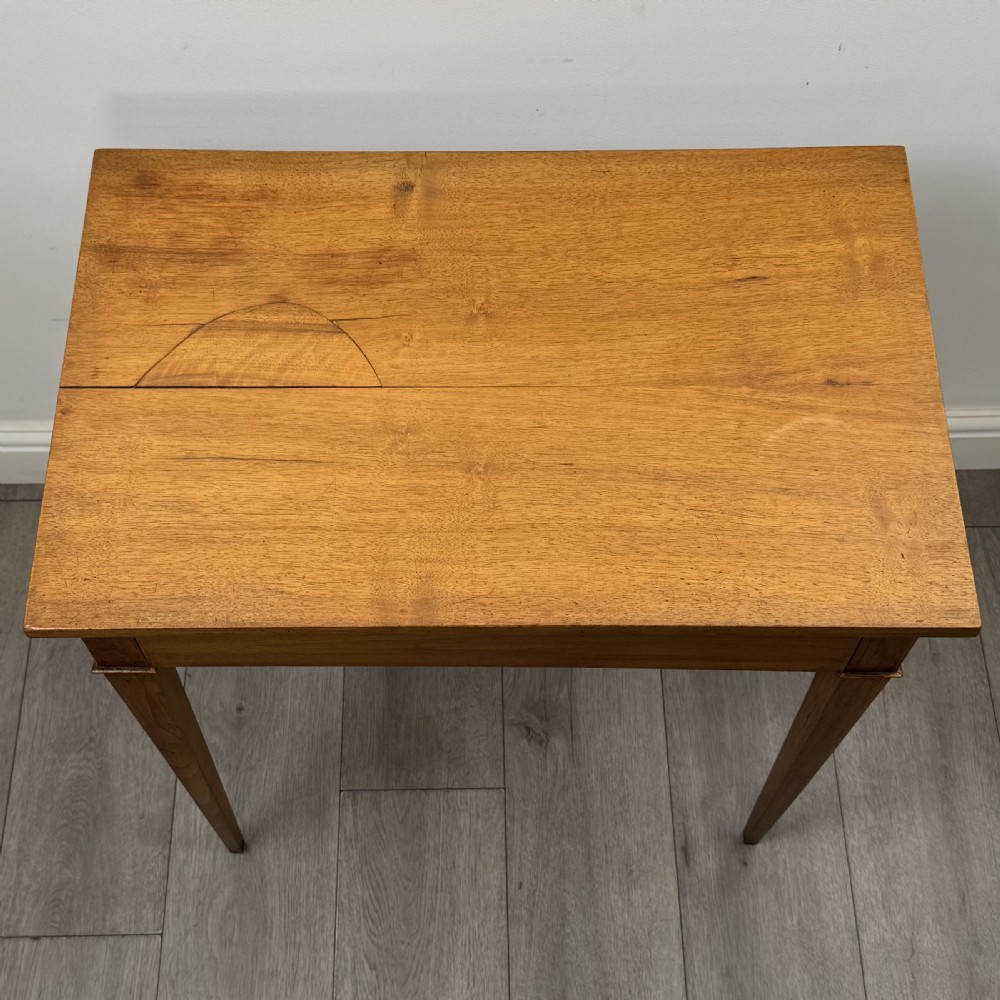 An antique early 20th-century walnut side table with a flat rectangular top, plain frieze, and four square tapered legs. View IX