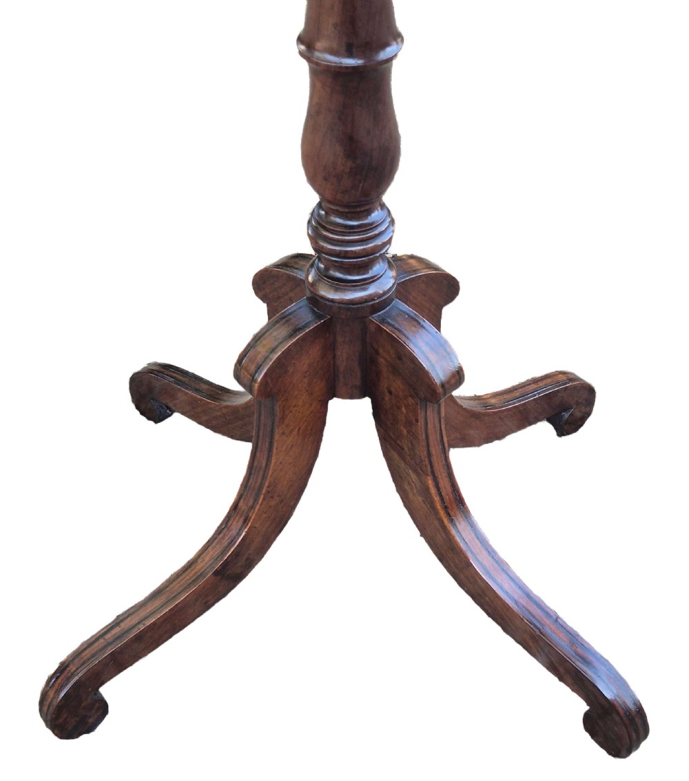 A Regency period rosewood occasional table featuring a brass inlaid rectangular top, a turned central pedestal, and three downswept tripod legs. View IV