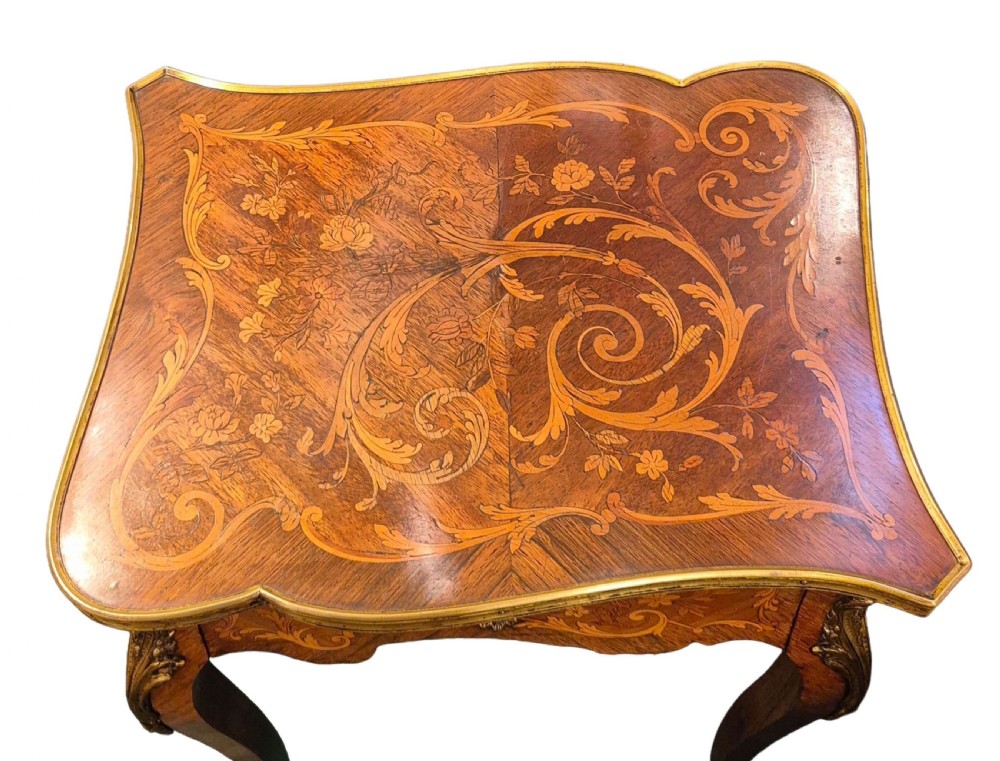 A 19th-century French Rococo Revival occasional table featuring floral marquetry wood veneers, cabriole legs, and cast ormolu mounts. View II