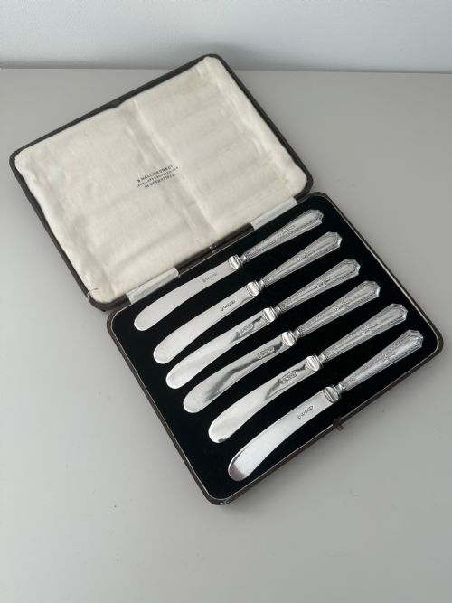  Edwardian silver set of butter knives.