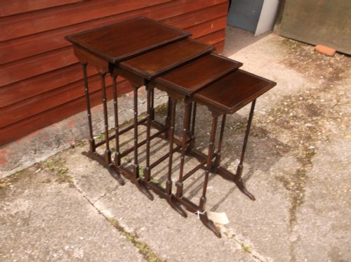 Nest of 4 Mahogany Tables.