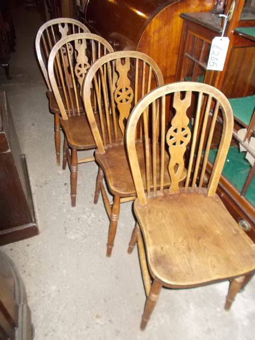 Set of 4 1920s Windsor Wheel Back Chairs.