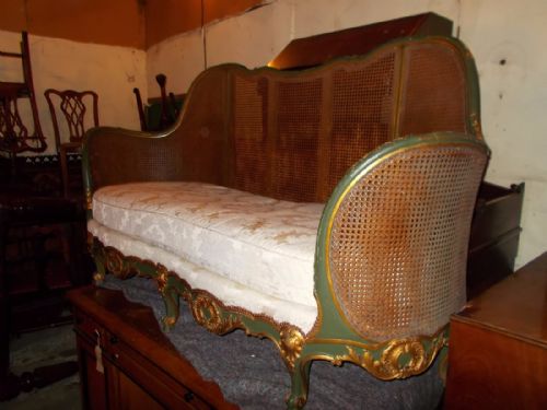 Early 20th Century Carved and Decorated Caned Settee.