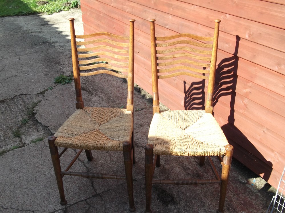 Pair of oak arts and crafts chairs