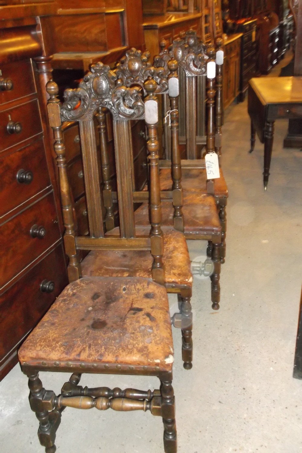 Pair of carved oak high back hall chairs